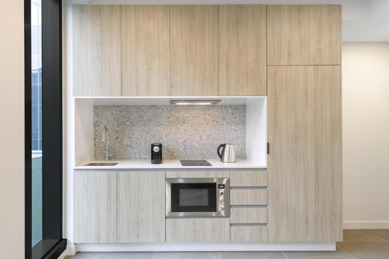 Meriton Suites Melbourne Eksteriør bilde A kitchen in a serviced apartment