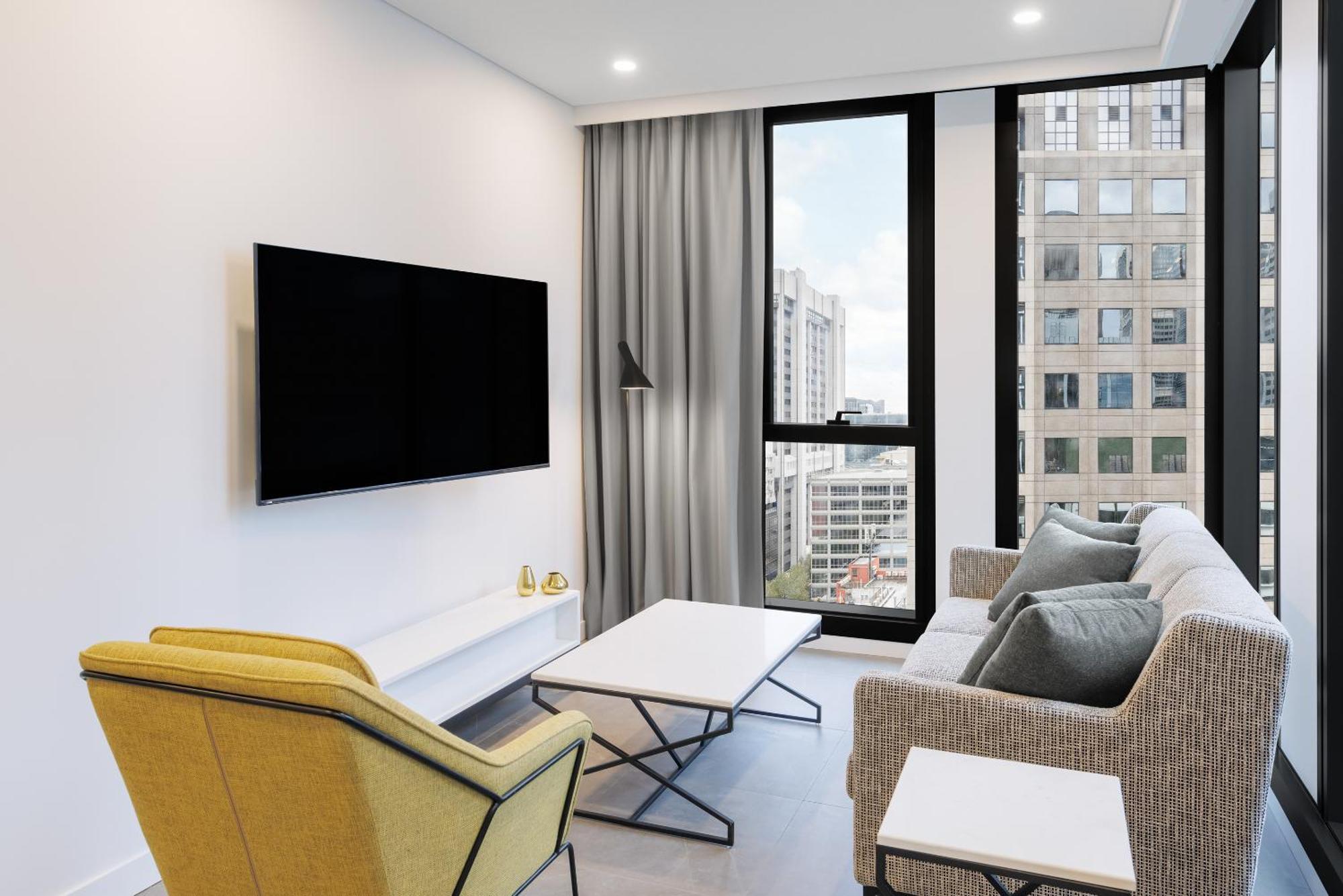 Meriton Suites Melbourne Eksteriør bilde A living room